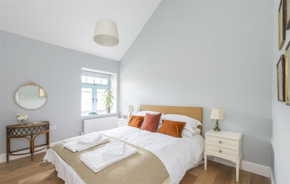 Ground floor bedroom two with a king-size bed and en-suite shower room at Stapleford Farm Cottages, Hooke