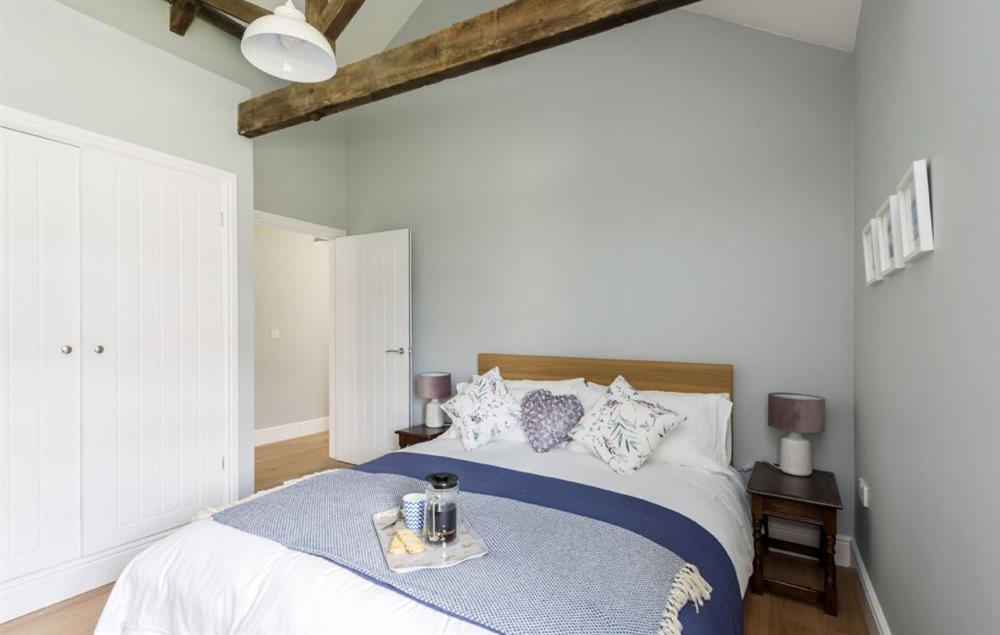 Ground floor bedroom two with king-size bed at Stapleford Farm Cottages, Hooke