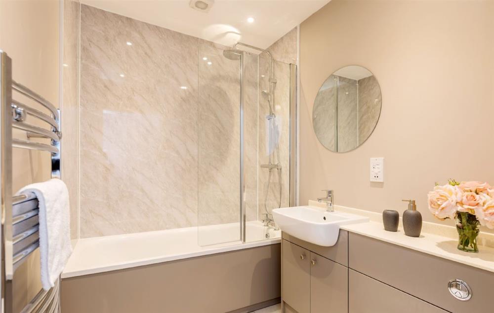 Ground floor family bathroom with bath and shower over at Stapleford Farm Cottages, Hooke