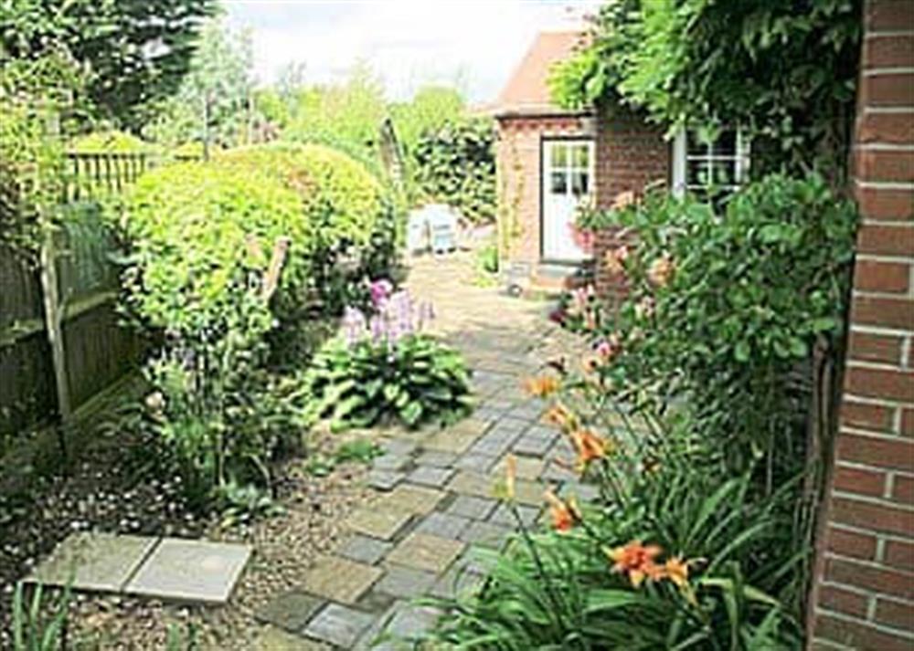 Garden areas around the patio at Starboard Cottage in Winterton-on-Sea, near Great Yarmouth, Norfolk