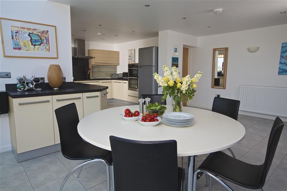 Dining area leading into the kitchen at Starboard Light in Malborough, Salcombe