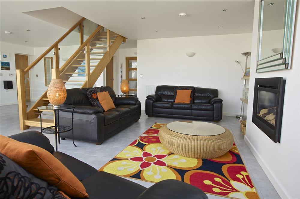 Open plan living area with stairs leading to the first floor at Starboard Light in Malborough, Salcombe