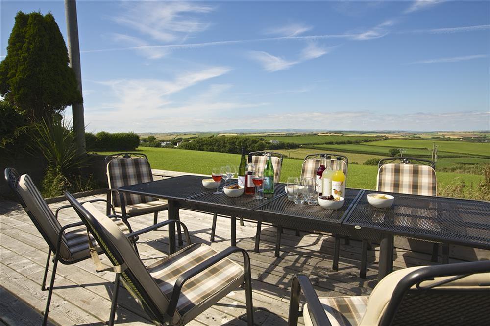 Views from the terrace extend across neighbouring farmland towards Dartmoor in the distance at Starboard Light in Malborough, Salcombe