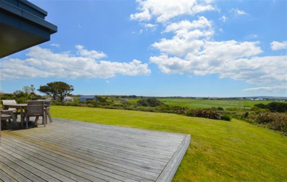 Large decked area with garden furniture and barbecue at Stargazy, Chapel Porth, St Agnes