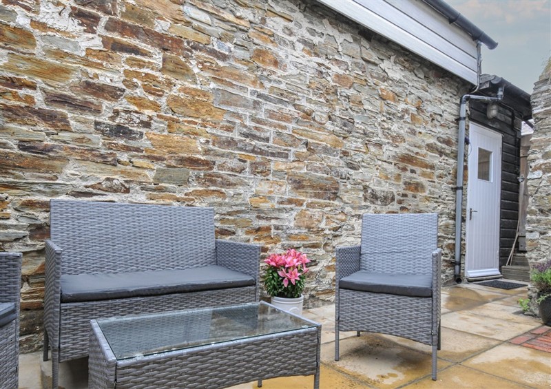 Enjoy a glass of wine on the patio at Stargazy, Trebarwith Strand near Tintagel
