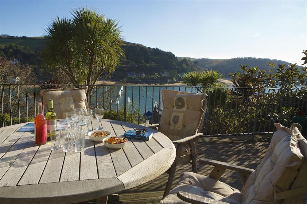 Large area of decking with garden at lower ground floor level at Startline House in Newton Road, Salcombe