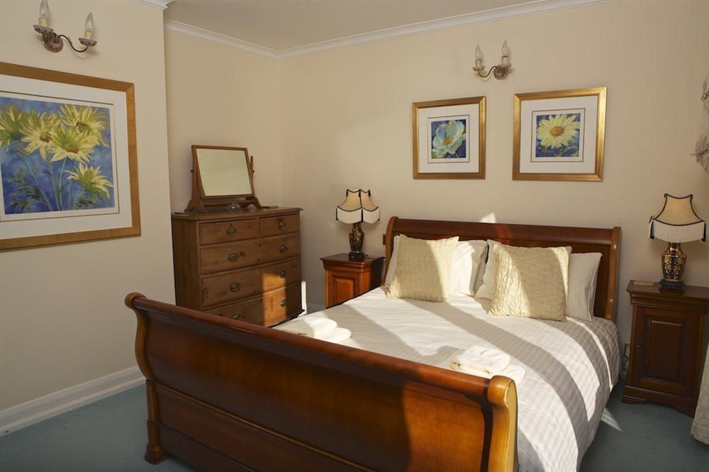 Master bedroom with sleigh bed and bay window to take in the superb view (photo 2) at Startline House in Newton Road, Salcombe