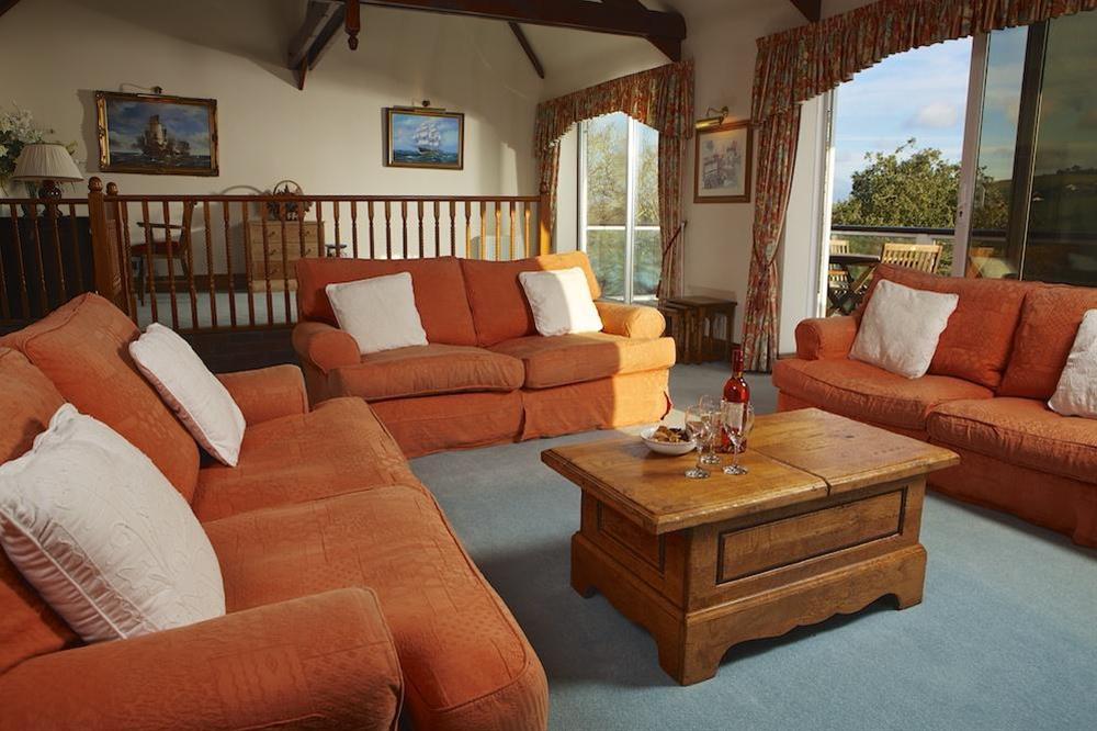 Spacious lounge with French doors onto the balcony at Startline House in Newton Road, Salcombe