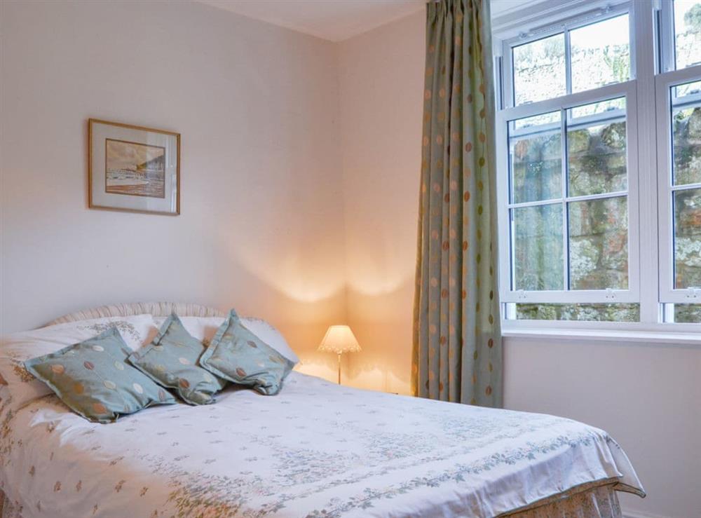 Warm and inviting double bedroom at Steephill Lodge in Ventnor, Isle of Wight