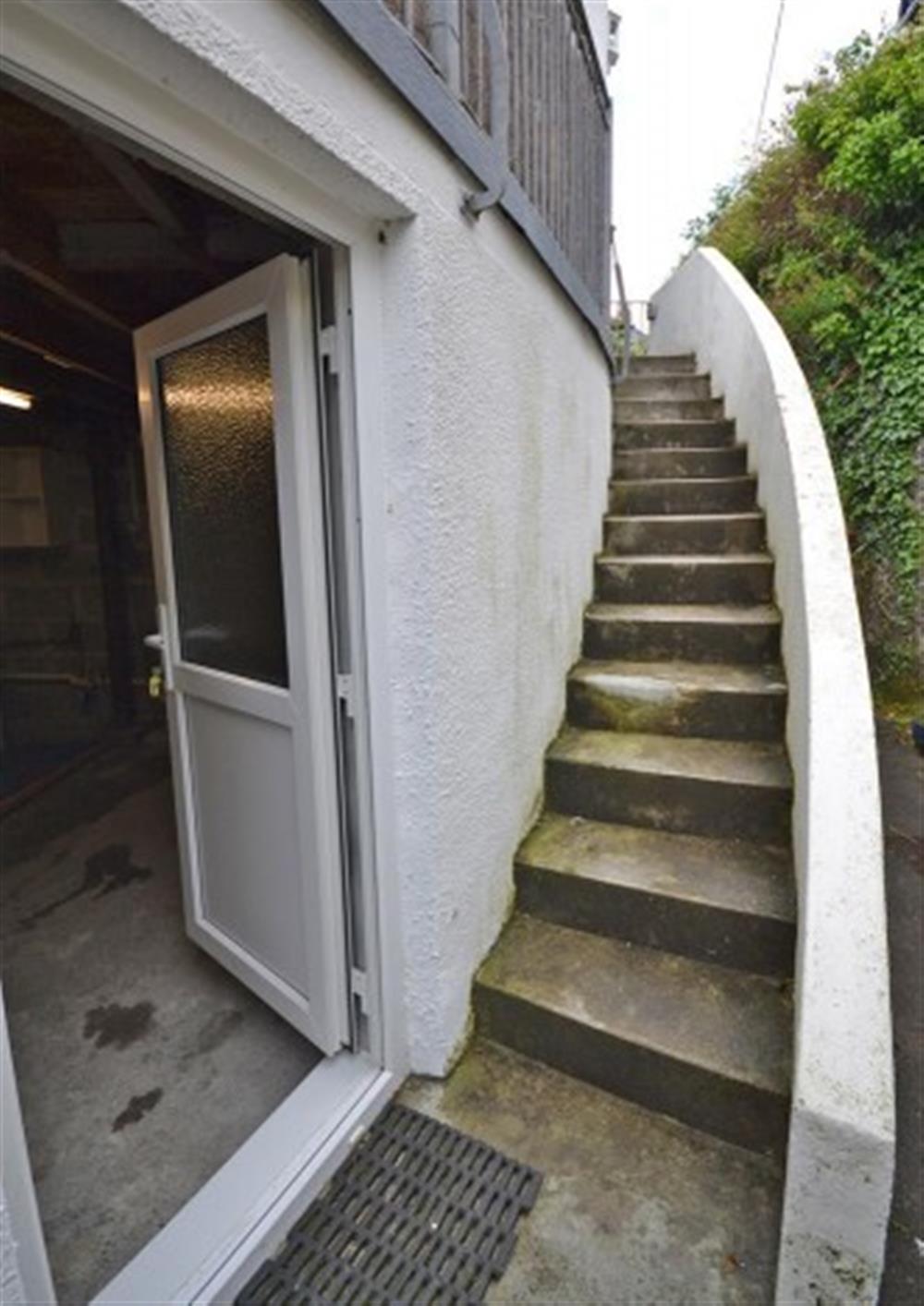Steps to the front door, via the garage side door, where the washing machine lives. at Step-A-Side in Looe