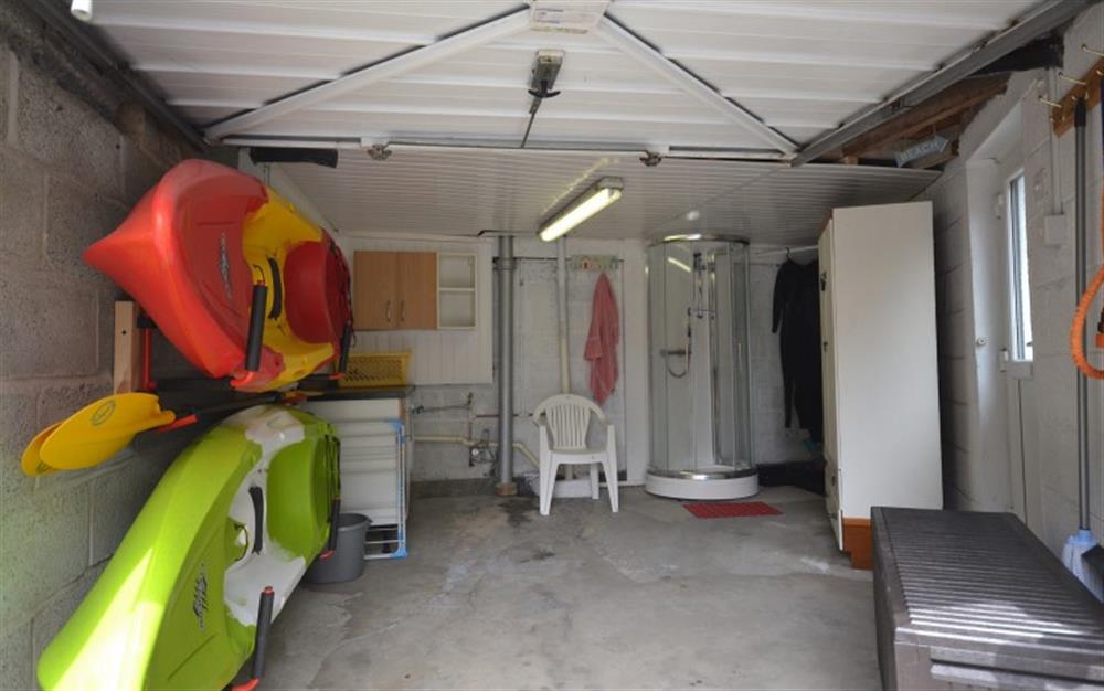 The very useful garage for guests use for storing their  kayaks (not provided) shower and washing machine. at Step-A-Side in Looe