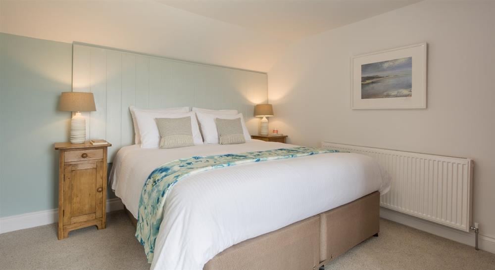 The double/twin bedroom with en-suite bathroom at Stepper View in Polzeath, Cornwall