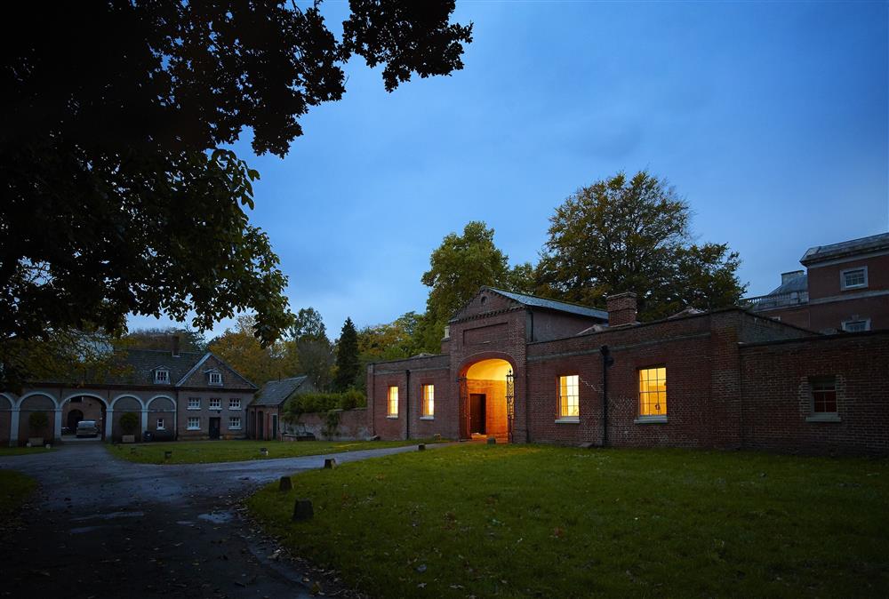 Former gate house with Stewards House on the right-hand side by twilight