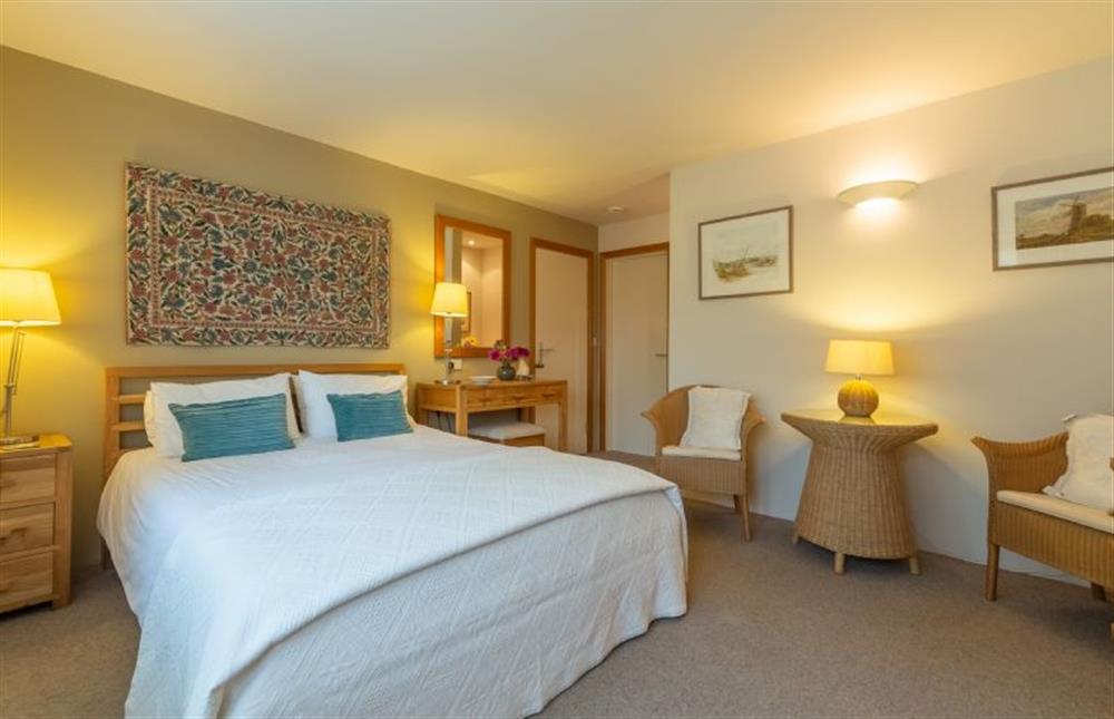 Ground floor: Bedroom with king-size bed at Stiffkey Hideaway, Stiffkey near Wells-next-the-Sea