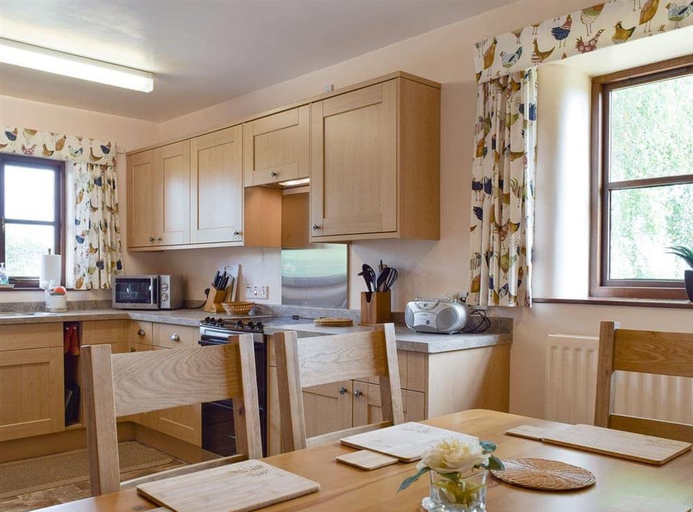 Convenient dining area within kitchen at Stildon Manor Cottage in Menith Wood, Worcestershire