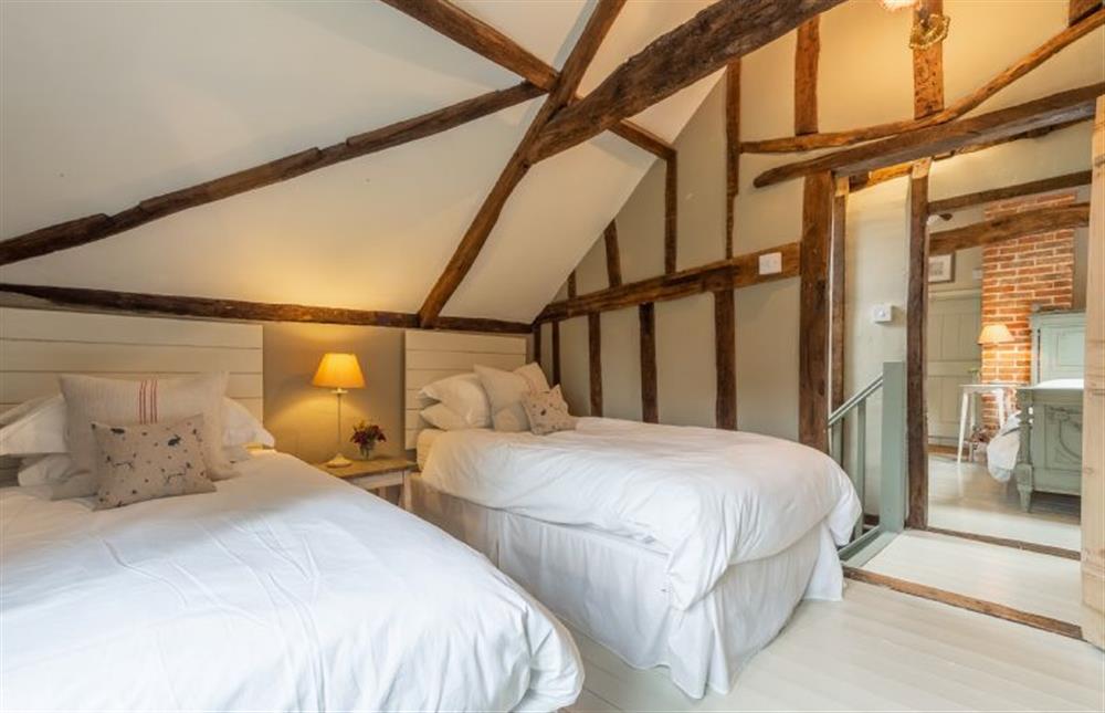 First floor: bedroom two, twin room with vaulted ceiling at Stockmans Cottage, Foulsham near Dereham