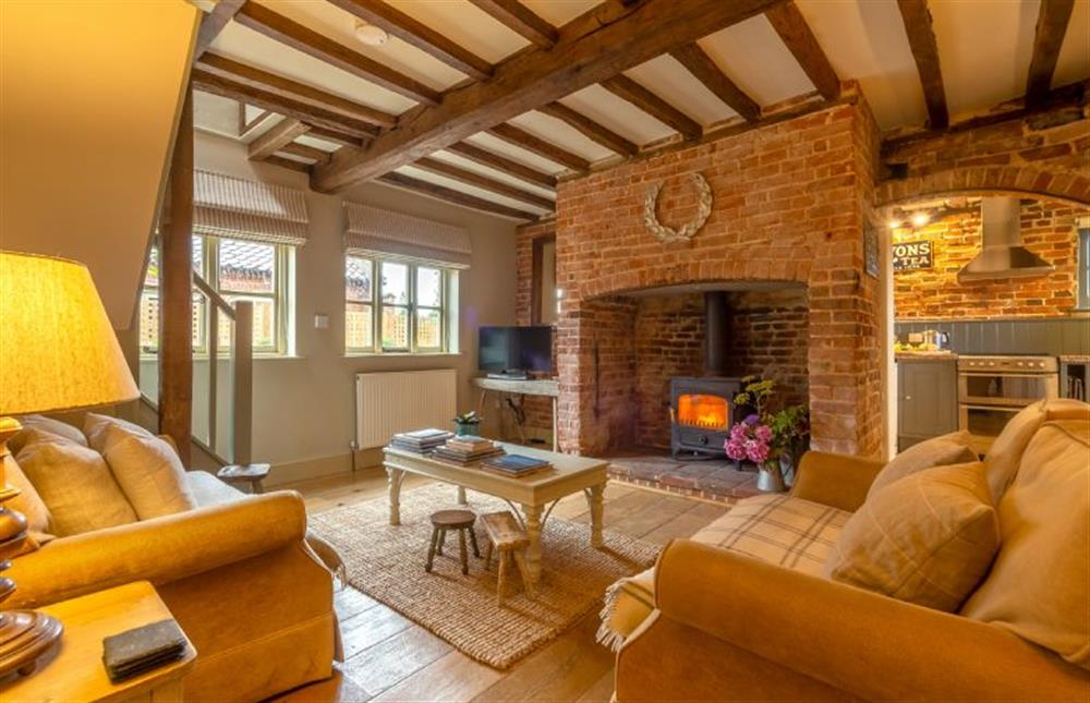 Stockmanfts Cottage: Cosy Sitting room has inglenook fireplace at Stockmans Cottage, Foulsham near Dereham