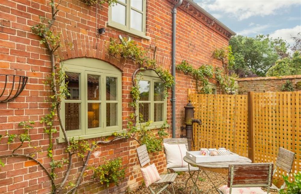 The secluded garden is great for al-fresco dining at Stockmans Cottage, Foulsham near Dereham