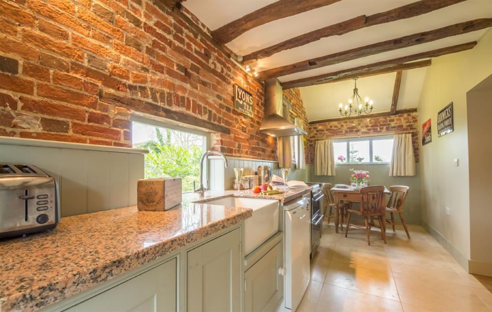 Kitchen/diner with a farmhouse table and chairs at Stockmans Cottage, Foulsham