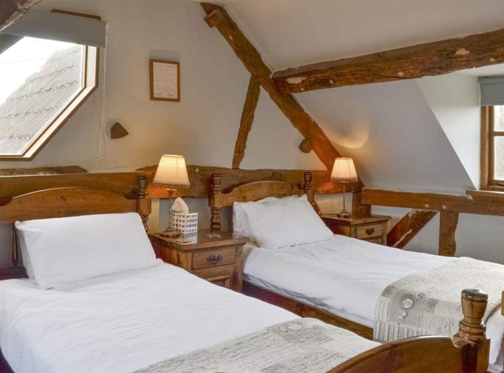 Characterful twin bedroom at Stocks Tree Cottage in Preston Wynne, Herefordshire