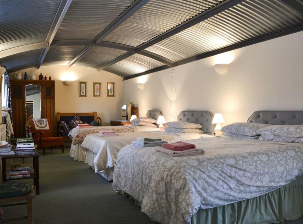 Family bedroom with en-suite at Stoke Court Farm Barn in Stoke St Milborough, Nr Ludlow., Shropshire