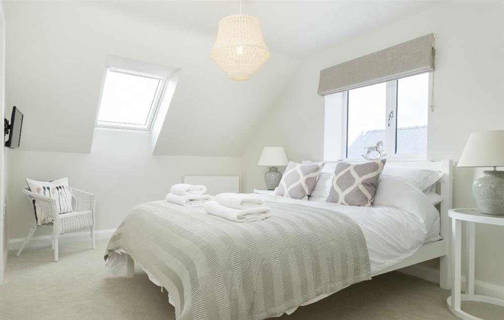 A light and airy king-size bedroom at Stone Barn, Upper Swell