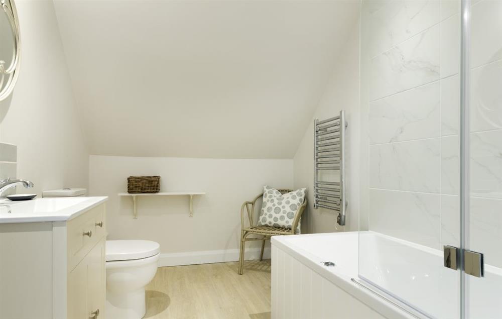 Family bathroom with bath and shower over at Stone Barn, Upper Swell