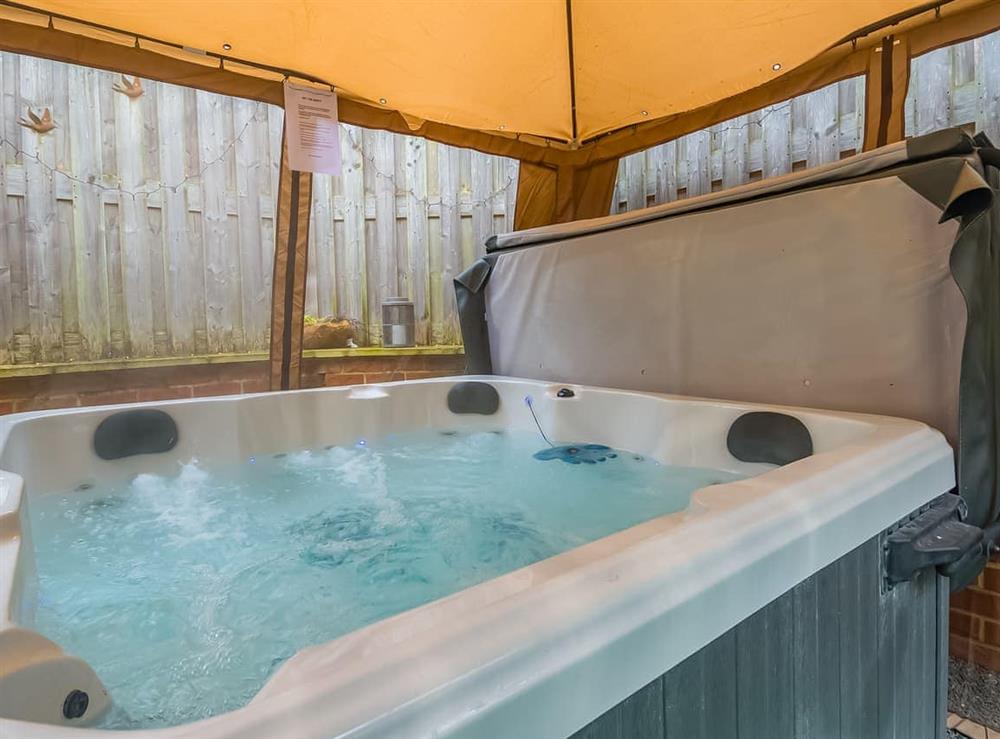 Hot tub at Stone Cottage in Blofield, Norfolk