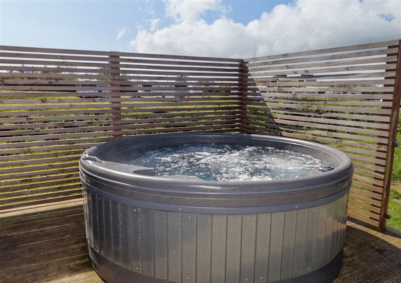 Relax in the hot tub at Stone Crab Lodge, Hasguard Cross near Broad Haven