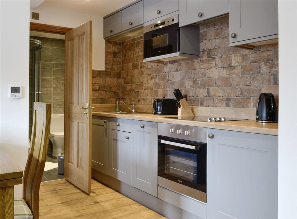 Well-equipped fitted kitchen at The Byres Tethera, 