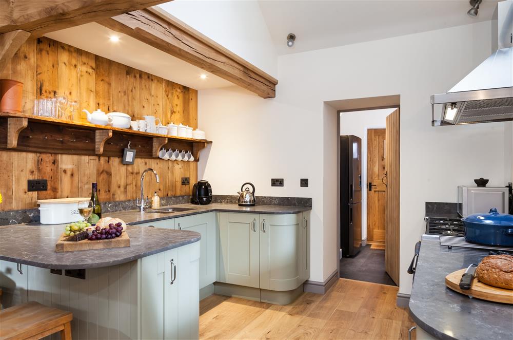 Bespoke well-equipped kitchen, with Tassimo coffee machine and sit-up bar with two stools at Stone House, Leominster