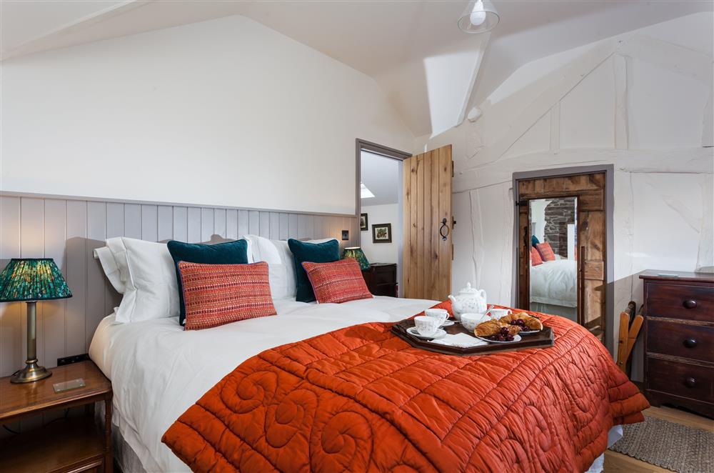 Muted colours create the perfect atmosphere for a peaceful nights sleep in bedroom two at Stone House, Leominster