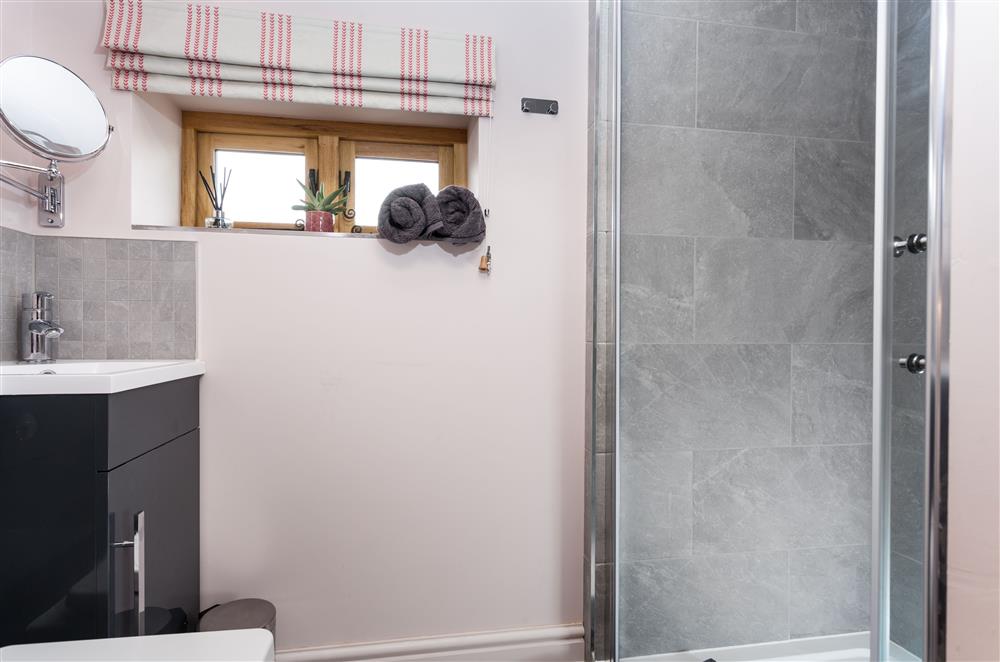 The en-suite shower room to bedroom one, with walk-in shower at Stone House, Leominster