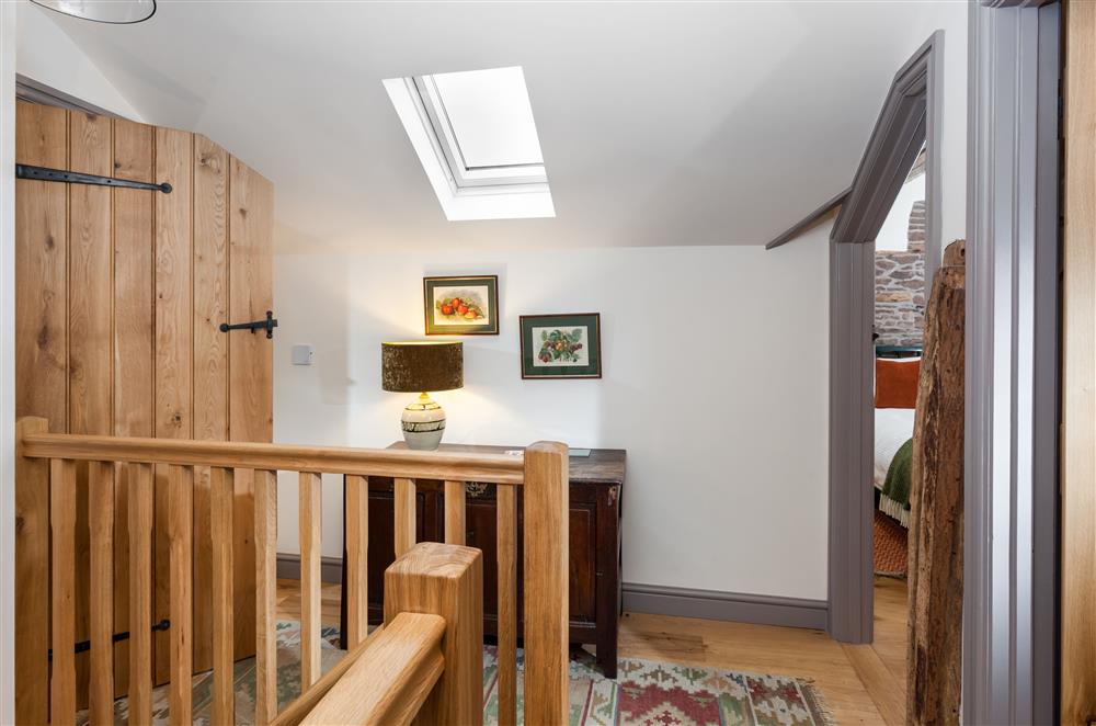 The first floor landing is bathed in natural light at Stone House, Leominster