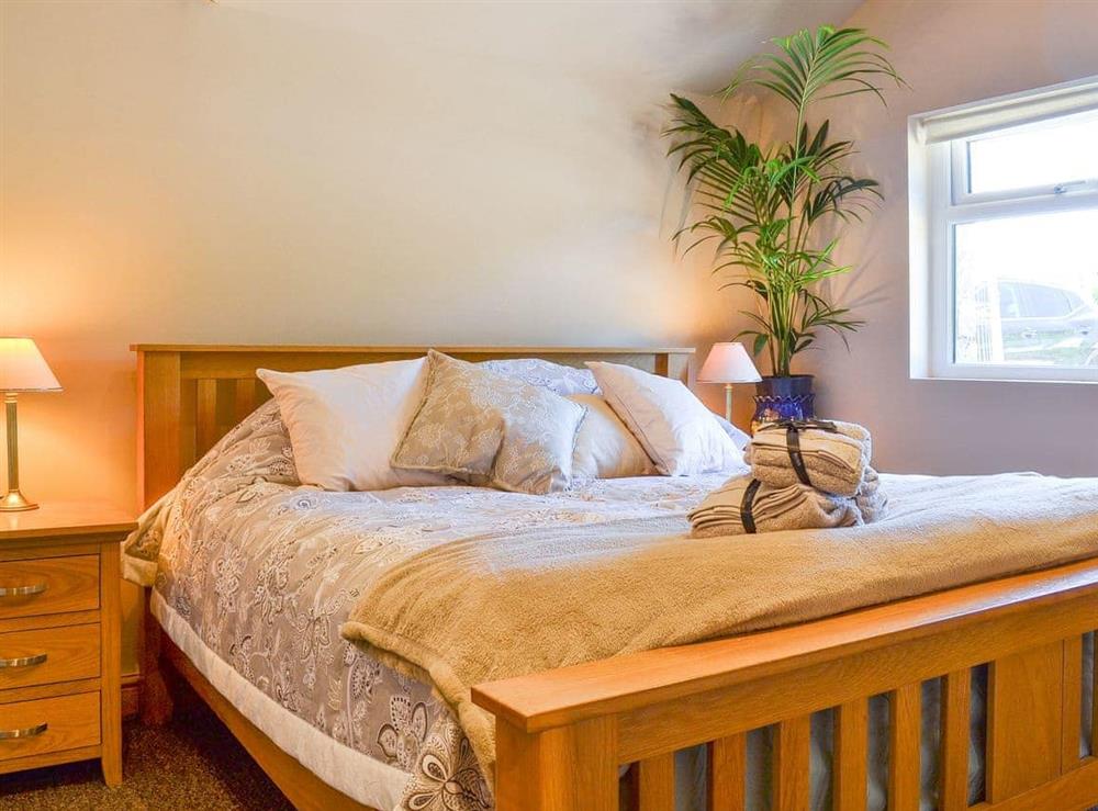 Inviting bedroom with super kingsize bed at Stonecroft Cottage in Broughton-in-Furness, near Barrow-in-Furness, Cumbria