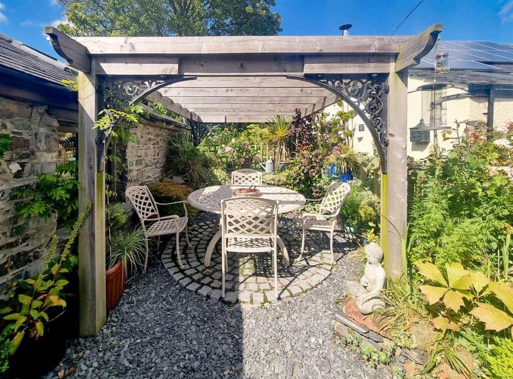 Lovely sunny sitting out area underneath the pergola at Stonecroft Cottage in Broughton-in-Furness, near Barrow-in-Furness, Cumbria