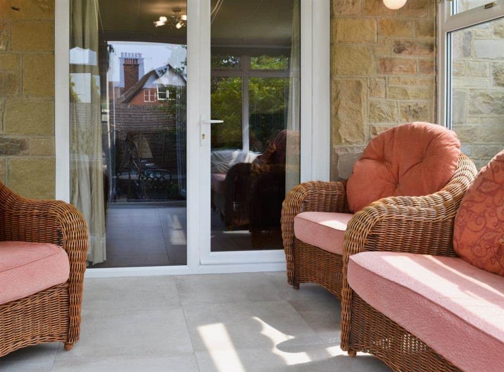 Conservatory with door leading to the enclosed courtyard