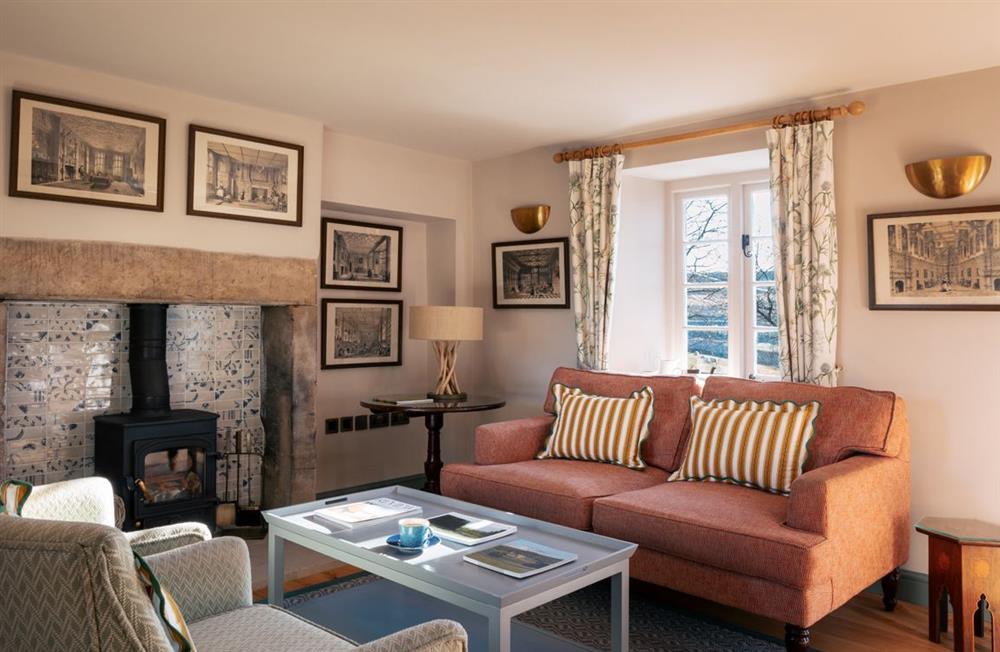 The cosy sitting room with a wood burning stove