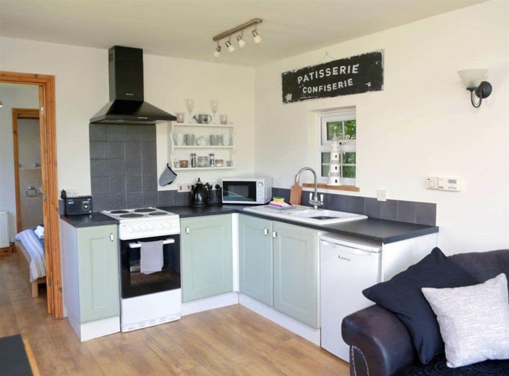Well-equipped fitted kitchen at Stones Cottage in Ormesby, near Great Yarmouth, Norfolk