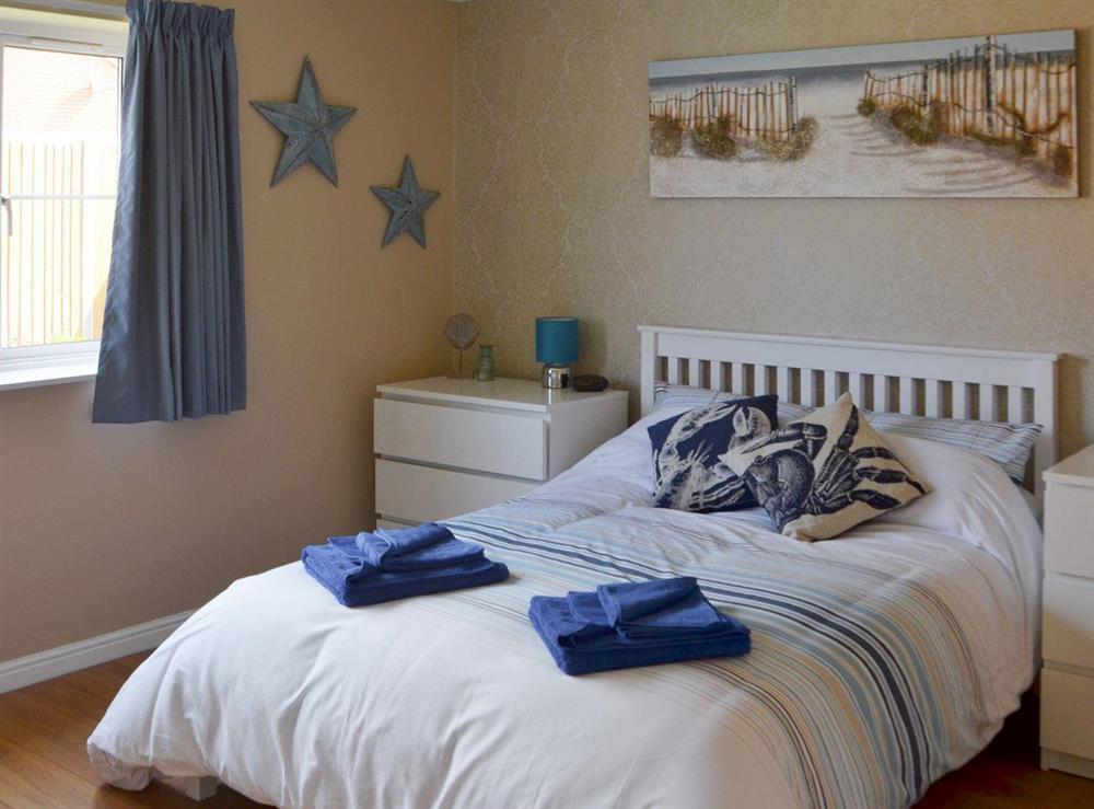 Large master bedroom at Stones Throw in Bacton, Norfolk