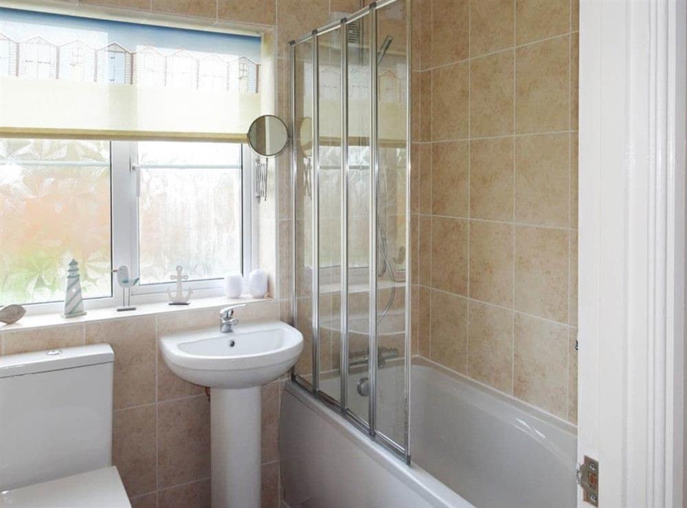 Lovely bathroom with shower over the bath at Stones Throw in Bacton, Norfolk