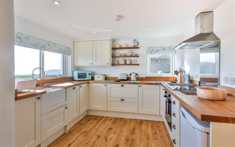 Kitchen with a view at Stoneybridge Cottage in East Portlemouth