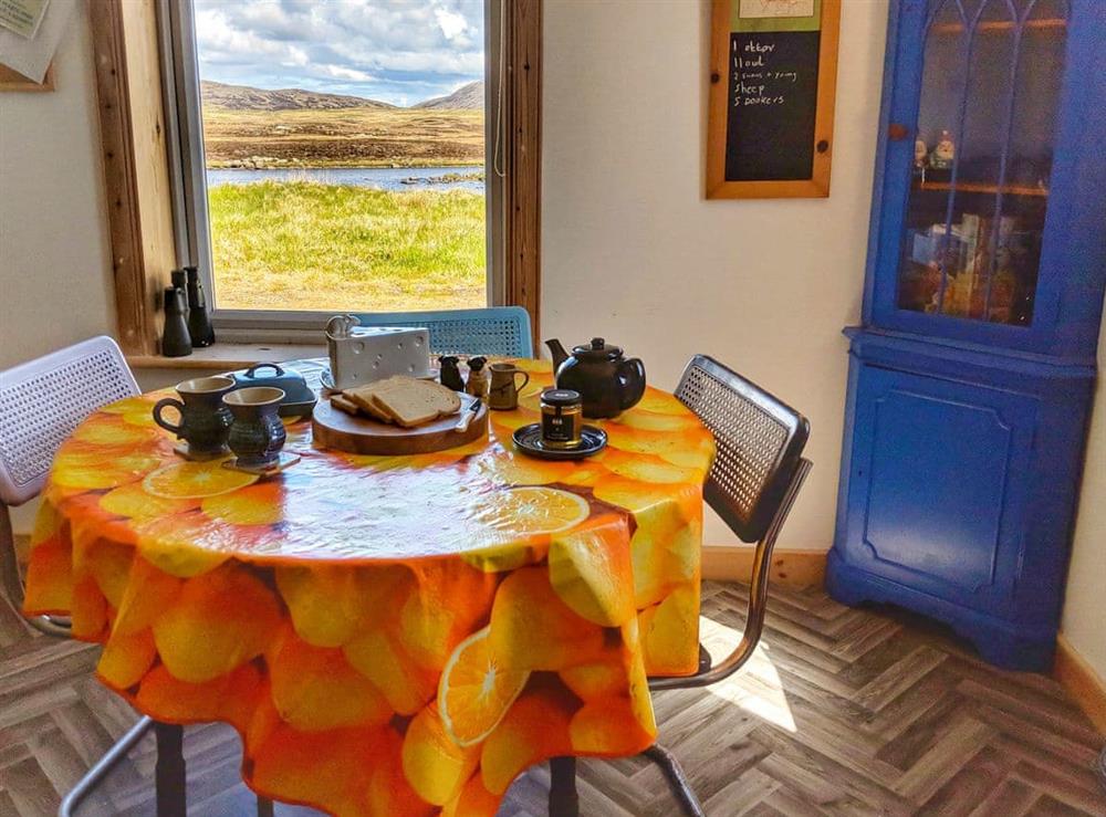 Dining area with lochside views at Stoneybridge in Stoneybridge, Isle of South Uist, Outer Hebrides, Scotland