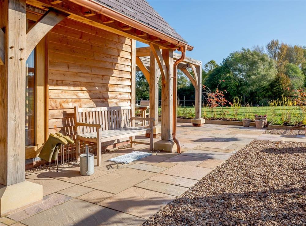 Extensive patio area within the garden at Hares Furrow, 