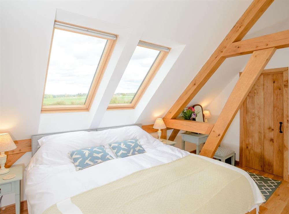 Inviting en-suite bedroom with zip-link king-size bed at Hares Furrow, 