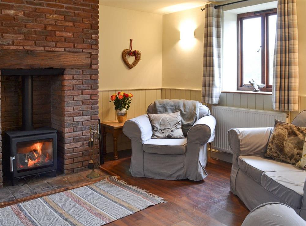 Living room with wood burner at Storey House Cottage in Hartoft, near Pickering, North Yorkshire