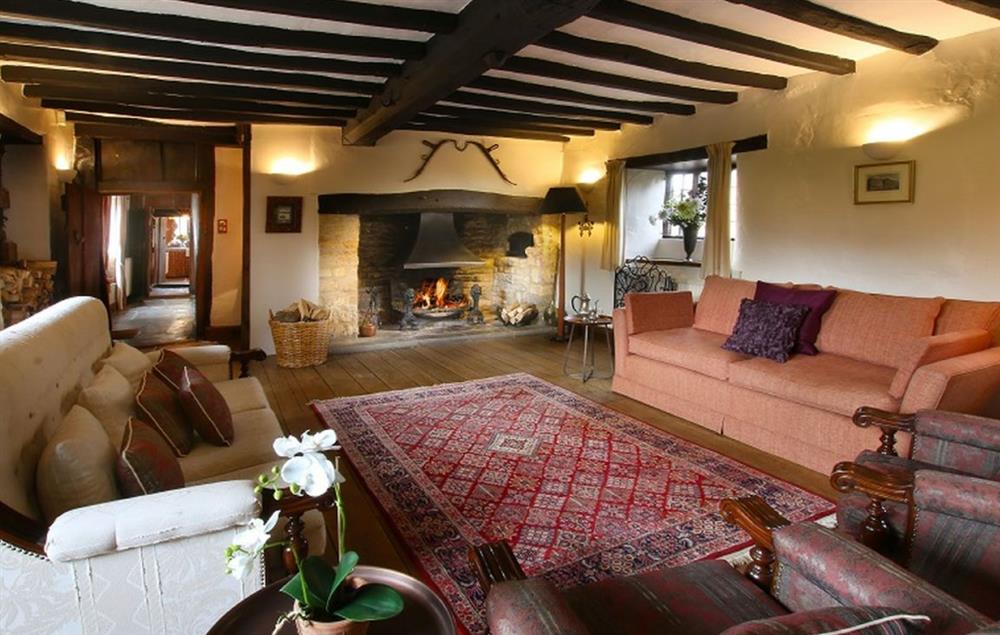 Elegant sitting room  with inglenook fireplace at Stourton Manor, Stourton
