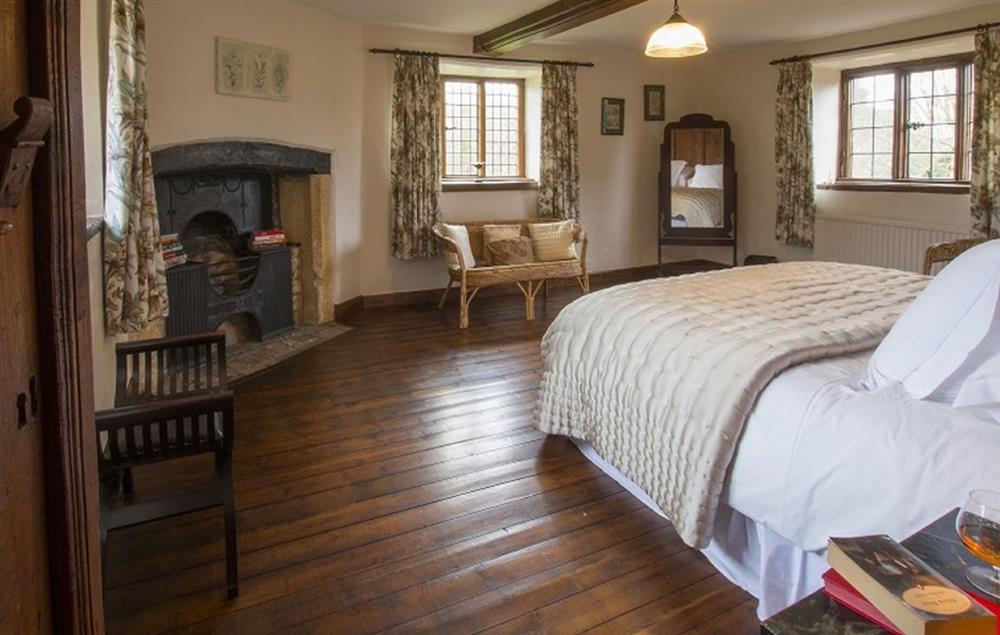 Triple aspect master bedroom with a 6’ super-king bed at Stourton Manor, Stourton