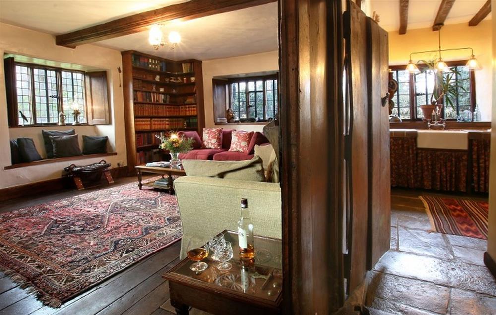 Wood panelled library with double aspect views at Stourton Manor, Stourton