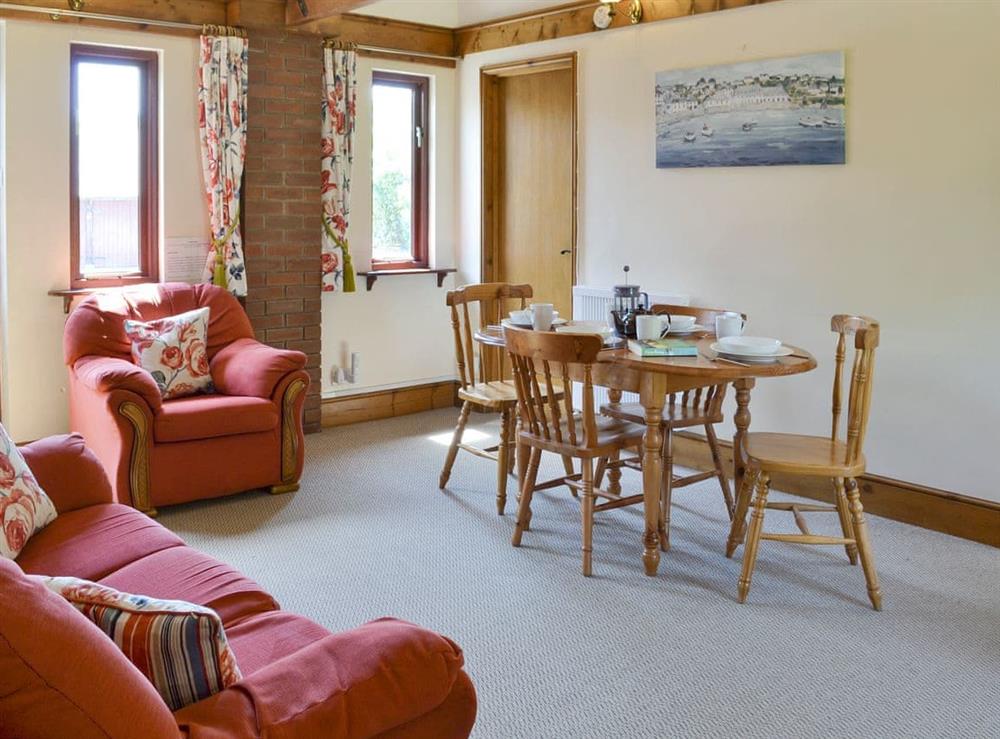 Spacious living and dining room at Halcyon Cottage, 